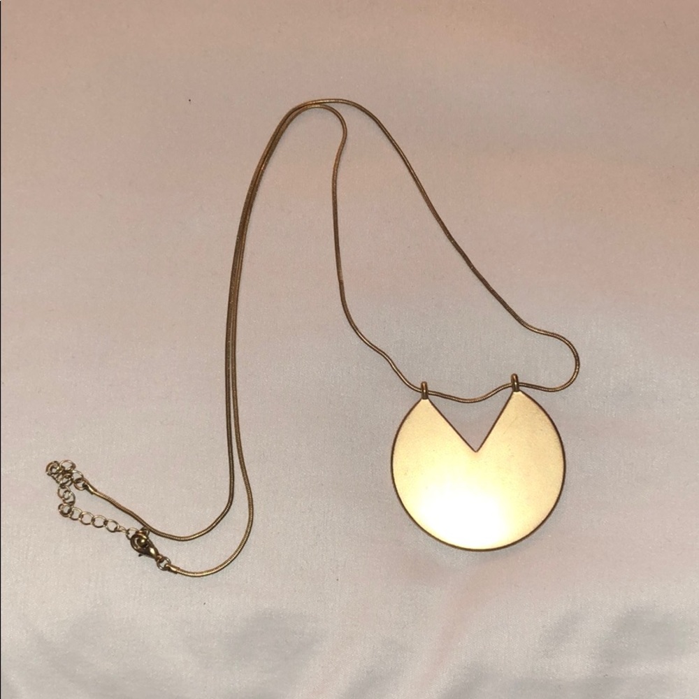 Gold circle with triangle cut out long necklace